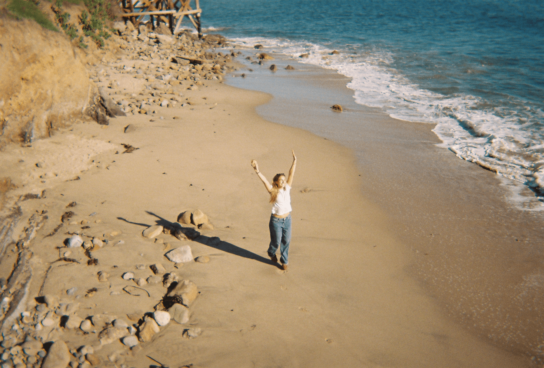 Ocean waves hitting the shore, captured in vintage film style